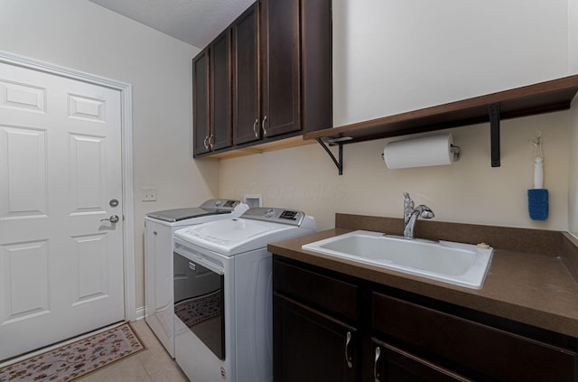 4502 Bens Ct Unit 31, Hilliard, OH 43026 - laundry area with washer and dryer, cabinet space, and light tile patterned floors