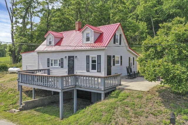 19616 N St, Laurelville, OH 43135 - back of house with a chimney, a deck, metal roof, a yard, and a patio area