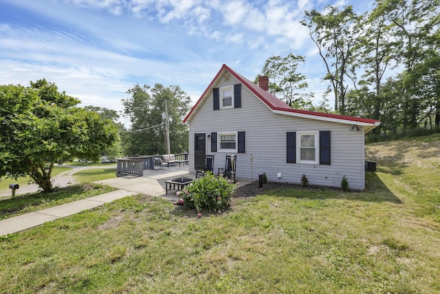 19616 N St, Laurelville, OH 43135 - rear view of house featuring a yard, a chimney, a patio, a deck, and central air condition unit