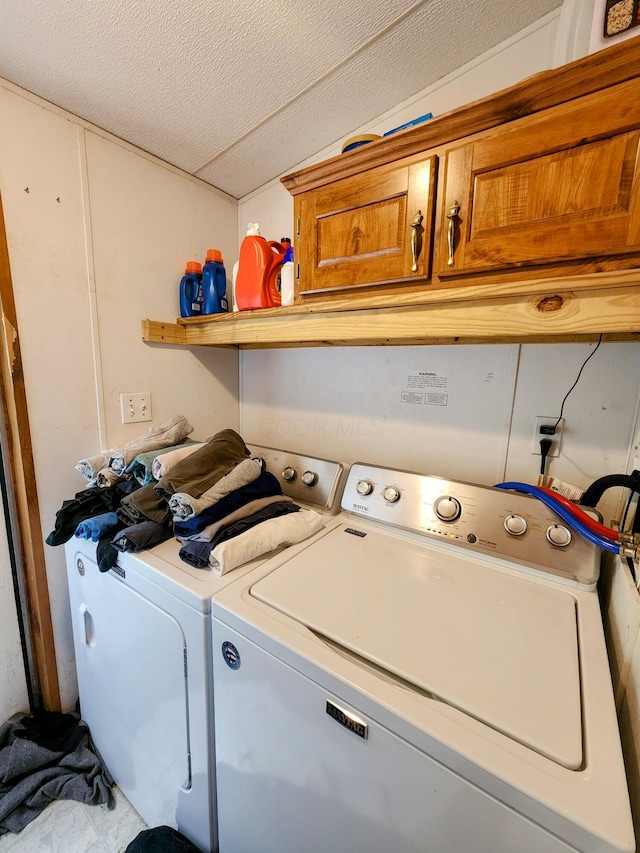 6960 Bluebell Rd, Cumberland, OH 43732 - laundry room featuring cabinet space and washing machine and clothes dryer