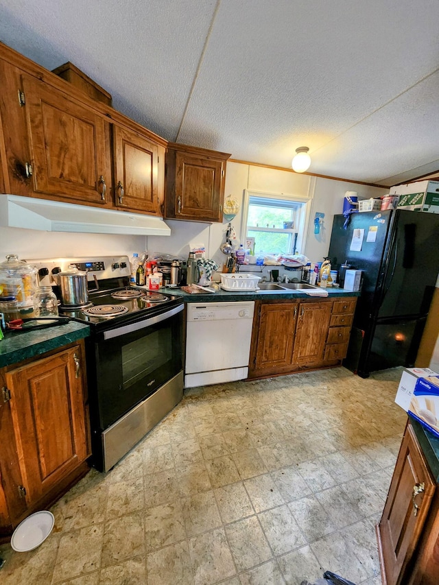 6960 Bluebell Rd, Cumberland, OH 43732 - kitchen with white dishwasher, electric range, freestanding refrigerator, a textured ceiling, and brown cabinets