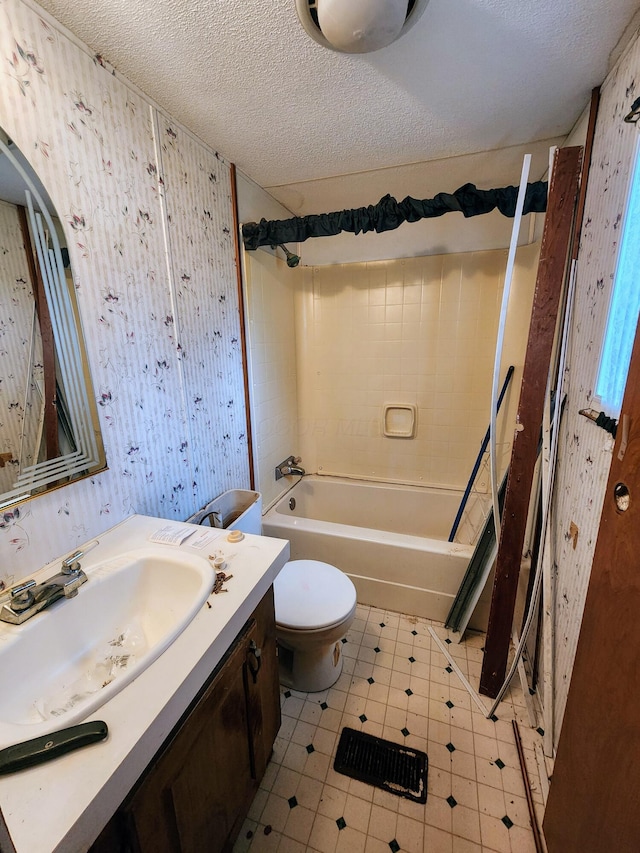 6960 Bluebell Rd, Cumberland, OH 43732 - bathroom with wallpapered walls, vanity, shower / bathtub combination, toilet, and a textured ceiling