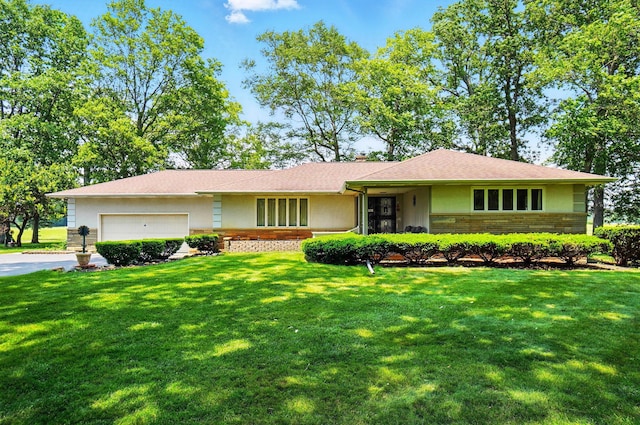 8430 Patterson Rd, Hilliard, OH 43026 - view of front facade with a front lawn, a garage, and brick siding