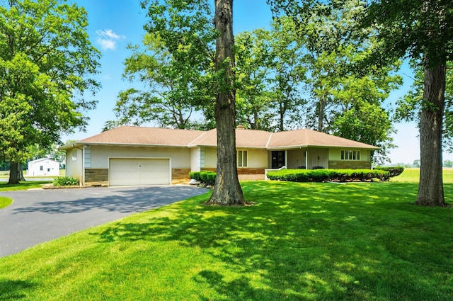 8430 Patterson Rd, Hilliard, OH 43026 - ranch-style home with a garage, asphalt driveway, a front yard, stone siding, and stucco siding