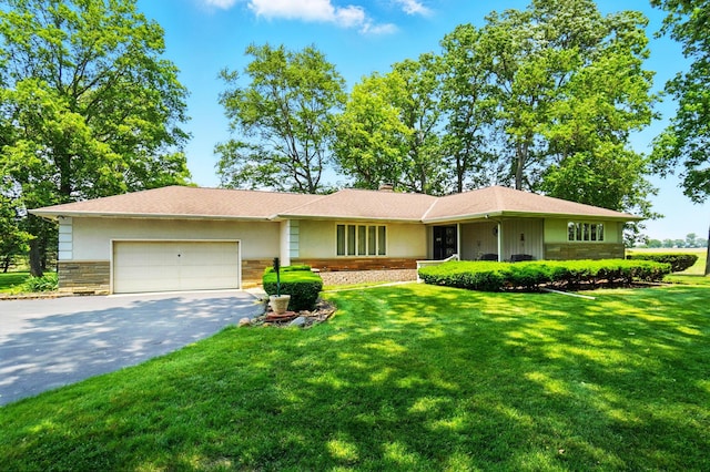 8430 Patterson Rd, Hilliard, OH 43026 - ranch-style home featuring driveway, a garage, a front lawn, stone siding, and a chimney