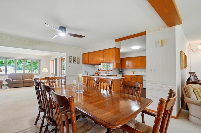 8430 Patterson Rd, Hilliard, OH 43026 - dining room with light carpet, a ceiling fan, and ornamental molding