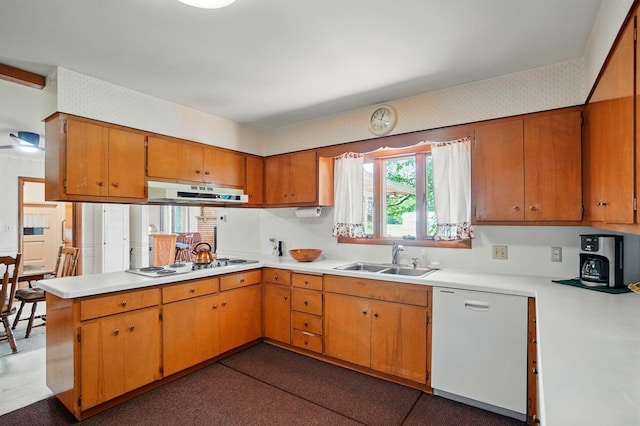 8430 Patterson Rd, Hilliard, OH 43026 - kitchen featuring a sink, white appliances, under cabinet range hood, light countertops, and a peninsula