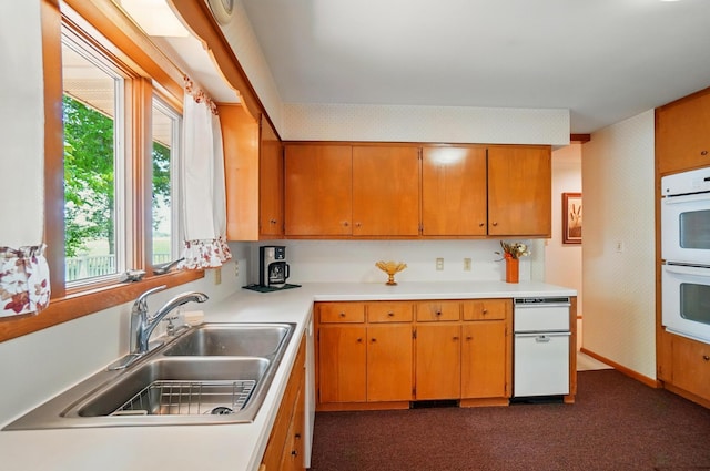8430 Patterson Rd, Hilliard, OH 43026 - kitchen featuring a sink, double oven, light countertops, dark colored carpet, and baseboards