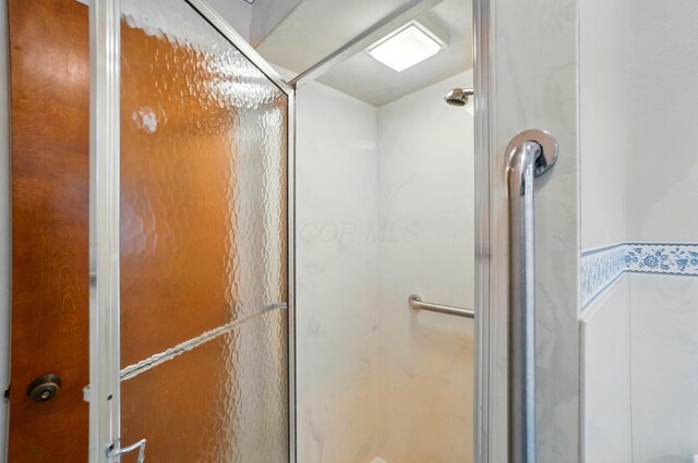 8430 Patterson Rd, Hilliard, OH 43026 - bathroom featuring a stall shower
