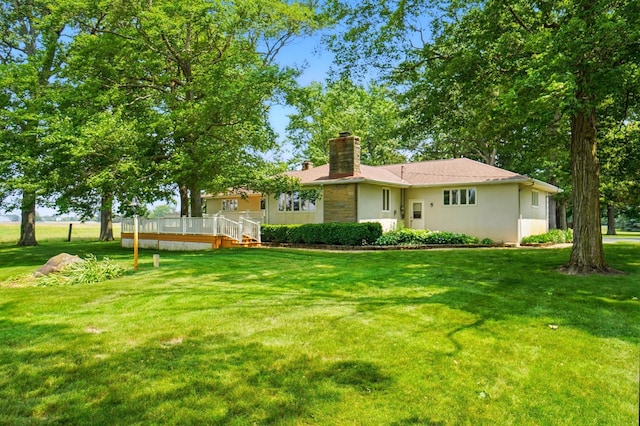 8430 Patterson Rd, Hilliard, OH 43026 - view of green lawn with a wooden deck