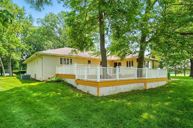 8430 Patterson Rd, Hilliard, OH 43026 - back of property with a yard, a deck, stucco siding, and a shingled roof