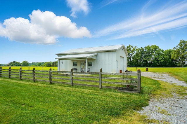 8430 Patterson Rd, Hilliard, OH 43026 - view of front of house featuring an outbuilding, metal roof, driveway, and a garage