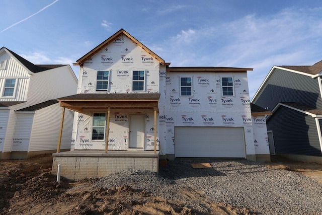 6865 Losino Ln, Hilliard, OH 43026 - property in mid-construction with a garage, covered porch, and driveway