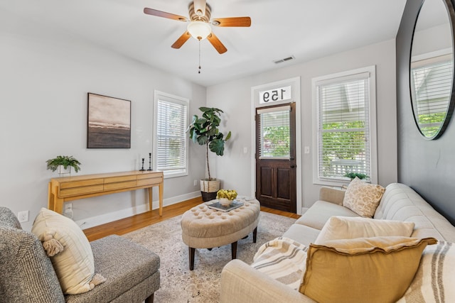 159 E 4th Ave, Columbus, OH 43201 - living room with wood finished floors, ceiling fan, and baseboards