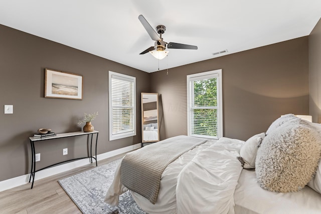 159 E 4th Ave, Columbus, OH 43201 - bedroom featuring light wood finished floors, baseboards, and a ceiling fan