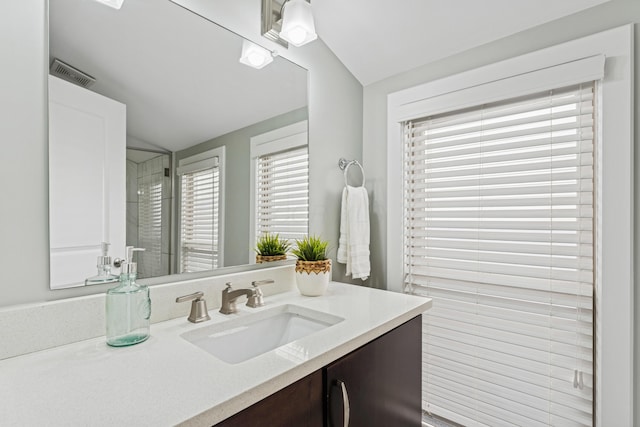 159 E 4th Ave, Columbus, OH 43201 - bathroom with lofted ceiling, vanity, and a shower with shower door