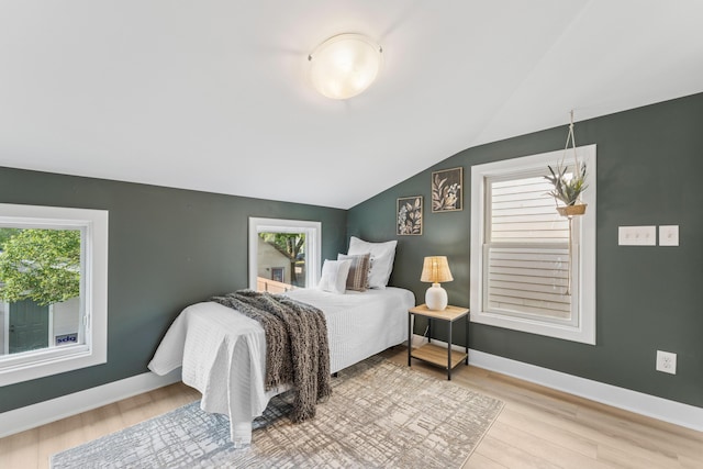 159 E 4th Ave, Columbus, OH 43201 - bedroom with light wood-type flooring, vaulted ceiling, and baseboards