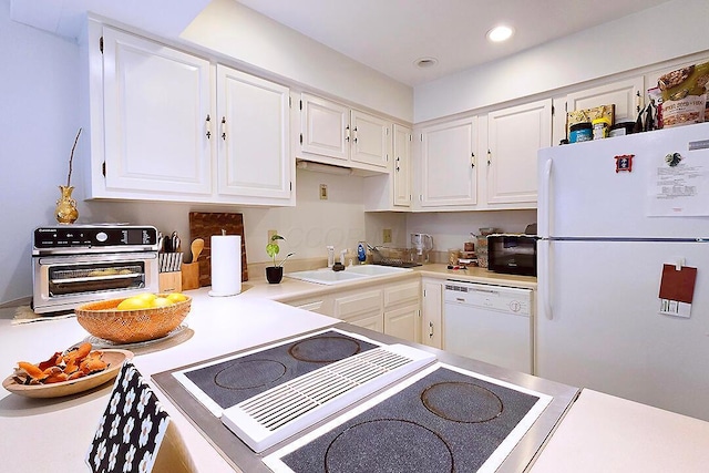 4760 Coach Rd Unit 14, Columbus, OH 43220 - kitchen with white appliances, a sink, white cabinets, recessed lighting, and light countertops