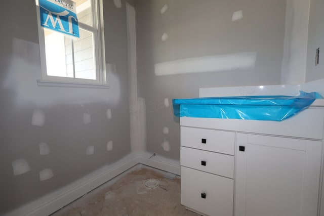 6946 Stillhouse Ln, Dublin, OH 43016 - bathroom featuring concrete flooring, vanity, and baseboards