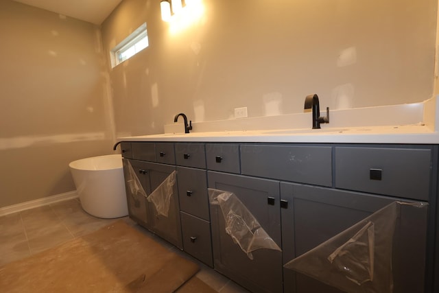 6946 Stillhouse Ln, Dublin, OH 43016 - full bathroom featuring a soaking tub, double vanity, and tile patterned flooring