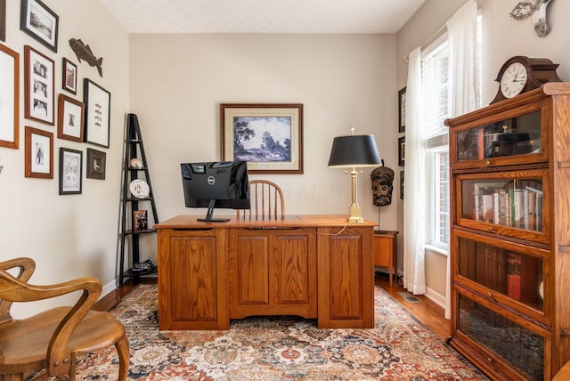 2545 Bryton Dr, Powell, OH 43065 - office with light wood-style flooring, healthy amount of natural light, and baseboards