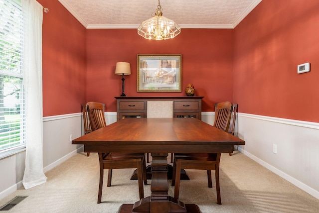 2545 Bryton Dr, Powell, OH 43065 - dining space featuring light carpet, a chandelier, baseboards, and ornamental molding