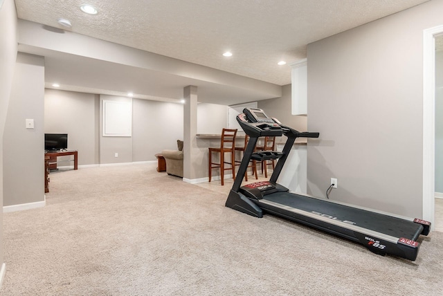 2545 Bryton Dr, Powell, OH 43065 - workout room with carpet floors, baseboards, recessed lighting, and a textured ceiling