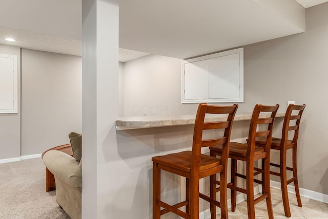 2545 Bryton Dr, Powell, OH 43065 - dining room with baseboards, a dry bar, recessed lighting, and light colored carpet