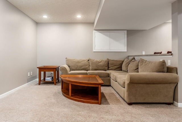 2545 Bryton Dr, Powell, OH 43065 - living area with light colored carpet, baseboards, a textured ceiling, and recessed lighting