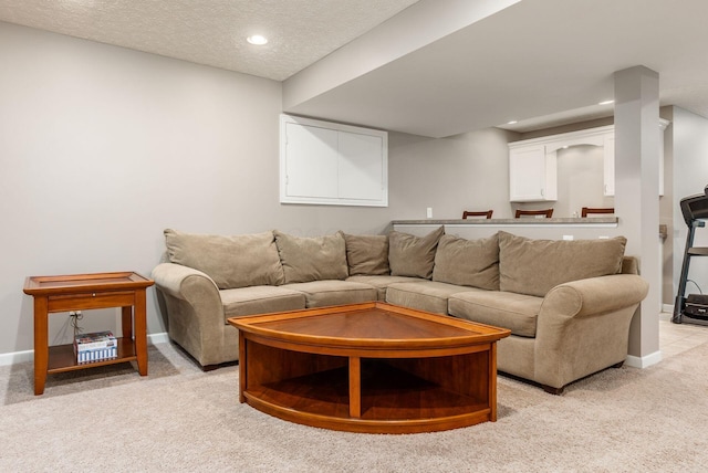 2545 Bryton Dr, Powell, OH 43065 - living area featuring light colored carpet, baseboards, a textured ceiling, and recessed lighting
