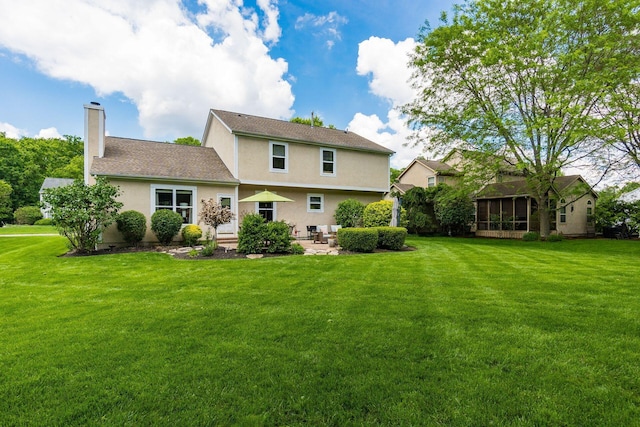 2545 Bryton Dr, Powell, OH 43065 - rear view of property with a chimney, a yard, and a patio