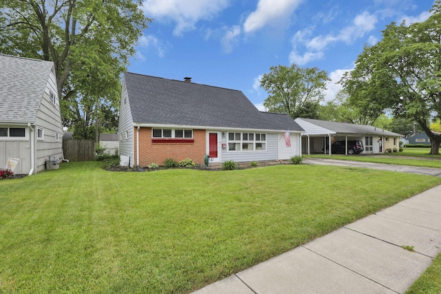 2971 Wendy Ln, Grove City, OH 43123 - view of front facade featuring concrete driveway, brick siding, a shingled roof, and an attached carport
