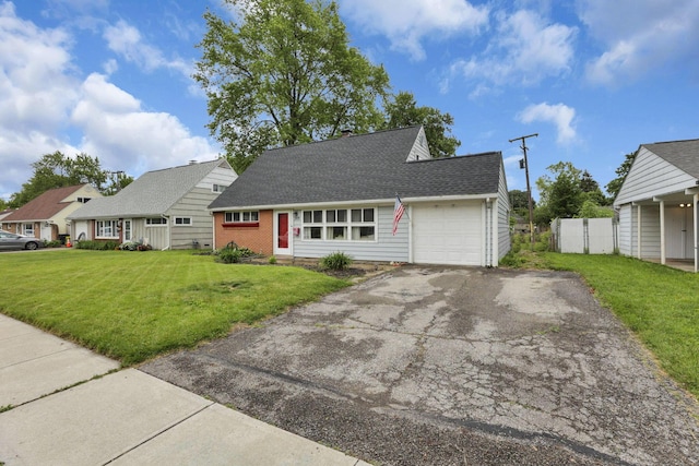 2971 Wendy Ln, Grove City, OH 43123 - view of front facade featuring an attached garage, asphalt driveway, and a shingled roof