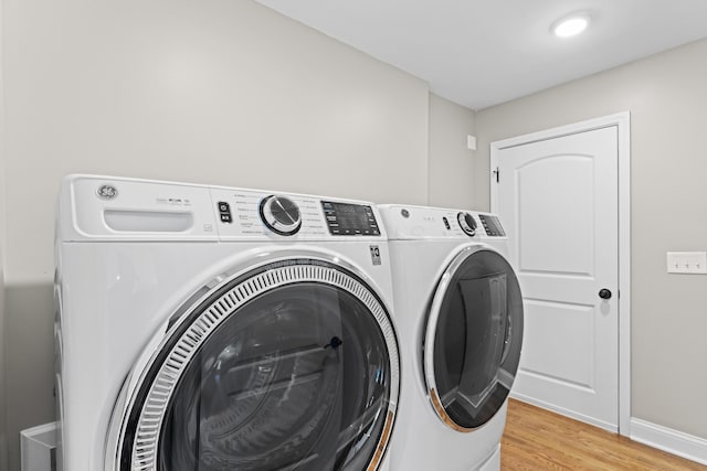 3531 Colchester Rd, Upper Arlington, OH 43221 - laundry room featuring independent washer and dryer, light wood-style flooring, and baseboards