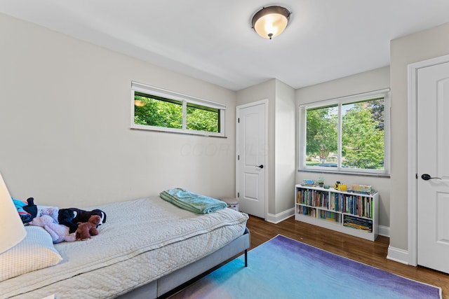 3531 Colchester Rd, Upper Arlington, OH 43221 - bedroom with multiple windows, wood finished floors, and baseboards