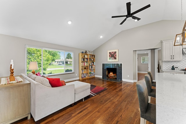 3531 Colchester Rd, Upper Arlington, OH 43221 - living room featuring lofted ceiling, a tiled fireplace, ceiling fan, dark wood-style floors, and recessed lighting