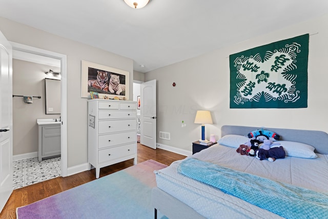 3531 Colchester Rd, Upper Arlington, OH 43221 - bedroom with wood finished floors, baseboards, and ensuite bathroom