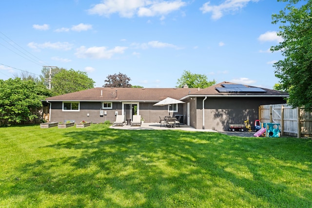 3531 Colchester Rd, Upper Arlington, OH 43221 - back of property with solar panels, a patio area, and stucco siding