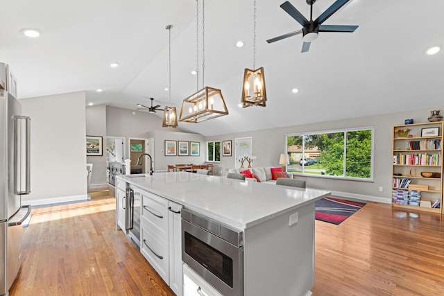 3531 Colchester Rd, Upper Arlington, OH 43221 - kitchen with open floor plan, appliances with stainless steel finishes, a chandelier, a ceiling fan, and recessed lighting