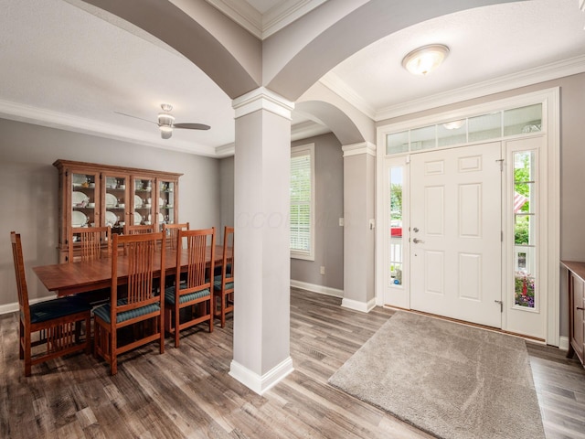6868 Beltain Ln Unit 37B, Dublin, OH 43016 - foyer with arched walkways, ornate columns, baseboards, wood finished floors, and crown molding