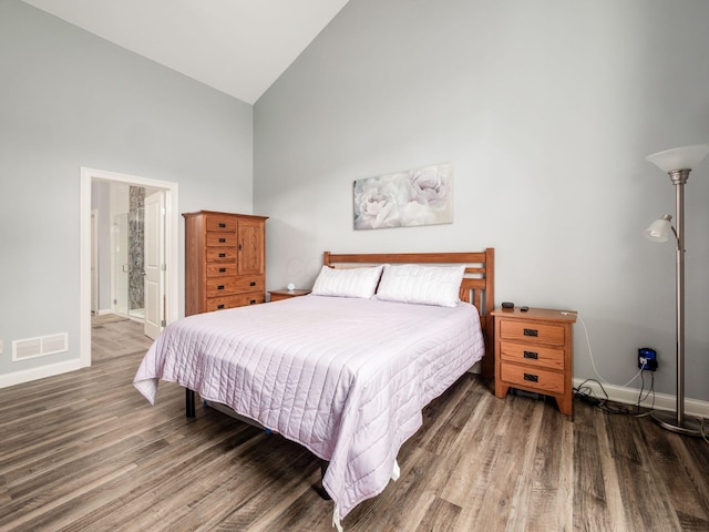 6868 Beltain Ln Unit 37B, Dublin, OH 43016 - bedroom featuring high vaulted ceiling, wood finished floors, baseboards, and connected bathroom