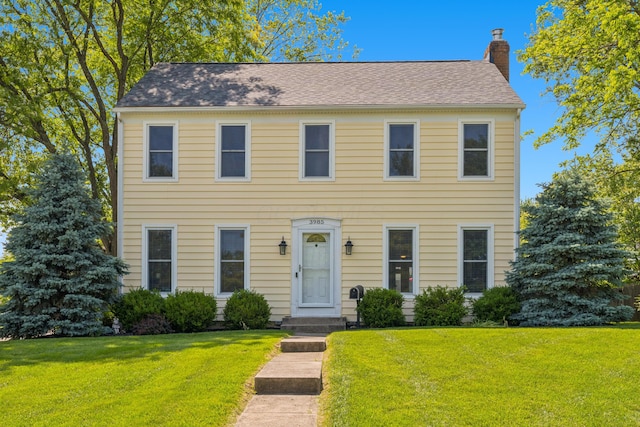 3985 Glenda Pl, Upper Arlington, OH 43220 - colonial home with a chimney and a front yard