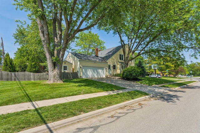 3985 Glenda Pl, Upper Arlington, OH 43220 - view of front of property with driveway, a garage, and a chimney