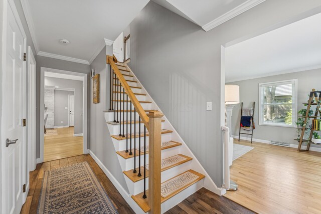 3985 Glenda Pl, Upper Arlington, OH 43220 - stairs with wood finished floors, crown molding, and baseboards
