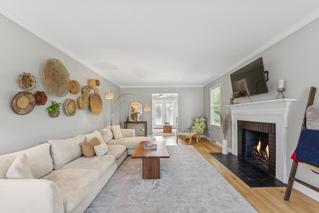 3985 Glenda Pl, Upper Arlington, OH 43220 - living room featuring a fireplace, wood finished floors, crown molding, baseboards, and ceiling fan