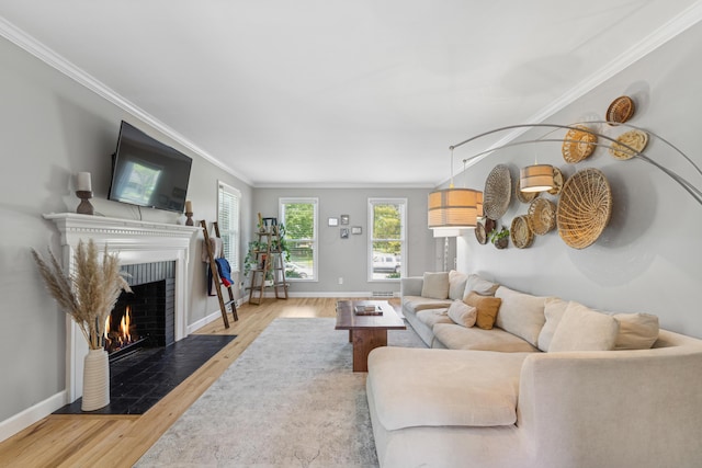 3985 Glenda Pl, Upper Arlington, OH 43220 - living area featuring a fireplace, crown molding, wood finished floors, and baseboards