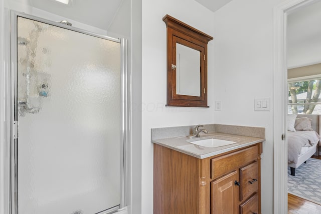 3985 Glenda Pl, Upper Arlington, OH 43220 - bathroom with a shower stall, ensuite bath, vanity, and wood finished floors