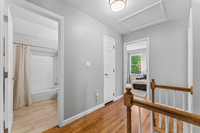 3985 Glenda Pl, Upper Arlington, OH 43220 - corridor featuring light wood-style flooring, attic access, and baseboards