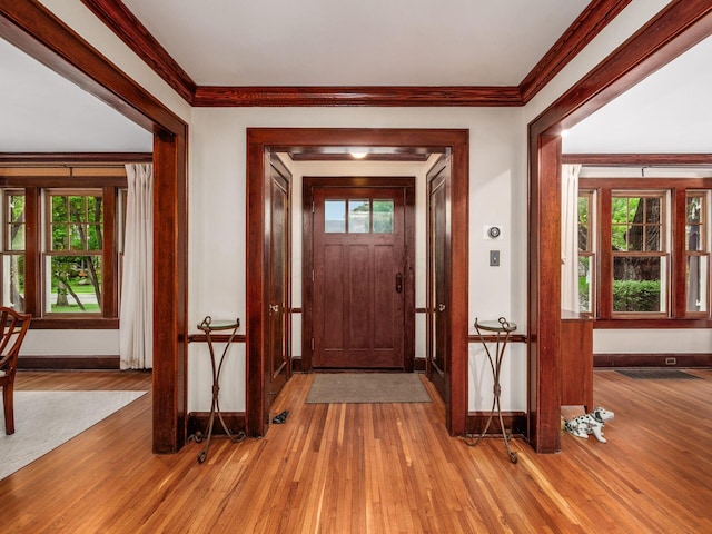 1635 Cambridge Blvd, Upper Arlington, OH 43212 - entrance foyer featuring baseboards, wood finished floors, plenty of natural light, and ornamental molding