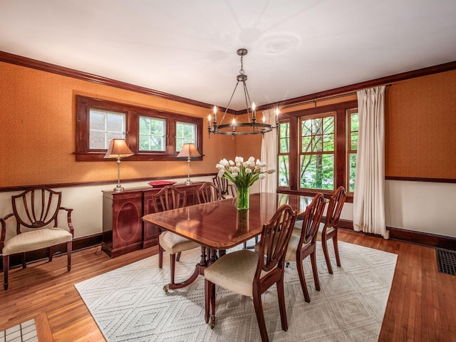1635 Cambridge Blvd, Upper Arlington, OH 43212 - dining room with a chandelier, wood finished floors, crown molding, healthy amount of natural light, and wallpapered walls